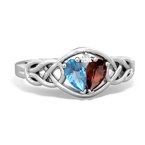 blue topaz-garnet celtic knot ring