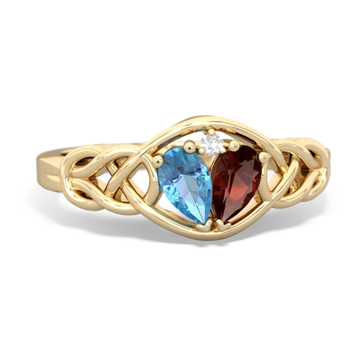 blue topaz-garnet celtic knot ring