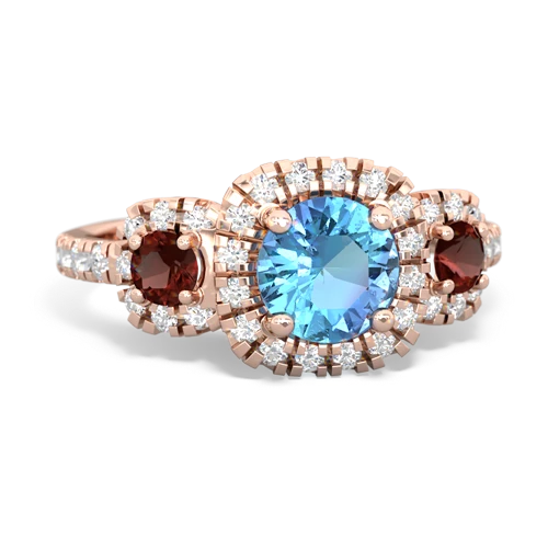 blue topaz-garnet three stone regal ring