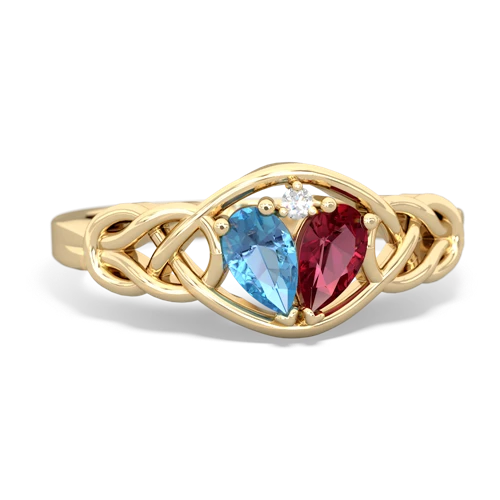 blue topaz-lab ruby celtic knot ring