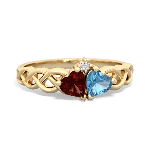 garnet-blue topaz celtic braid ring