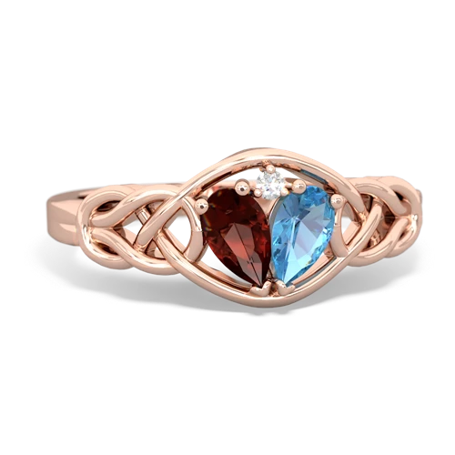 garnet-blue topaz celtic knot ring