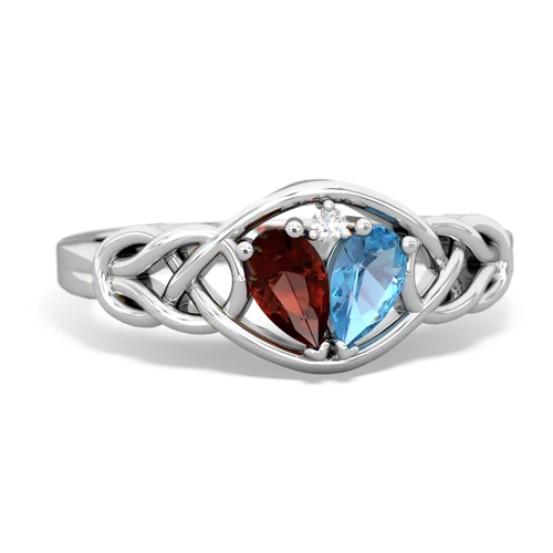 garnet-blue topaz celtic knot ring