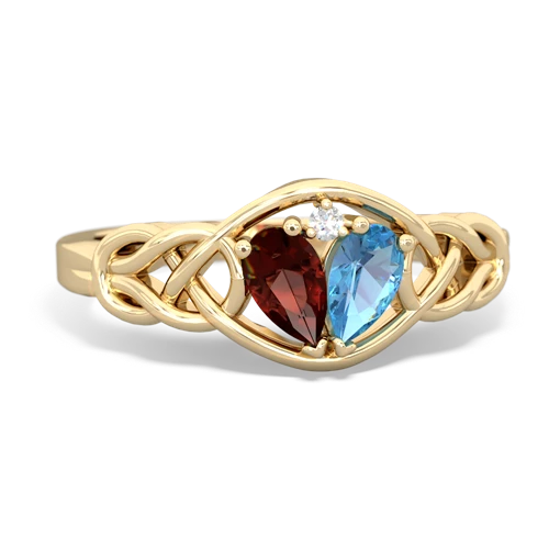 garnet-blue topaz celtic knot ring