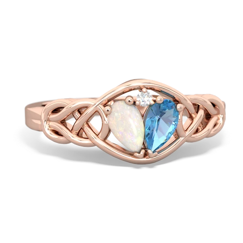 opal-blue topaz celtic knot ring